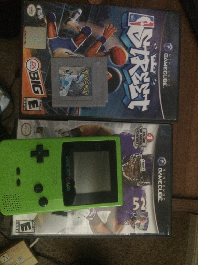 NBA Street, Madden 2005, Gameboy Color, and Pokemon Silver sits in Ron Davis' apartment in Columbia, Mo on Saturday, April 5th, 2015. These a couple games that Davis played a lot during his childhood.